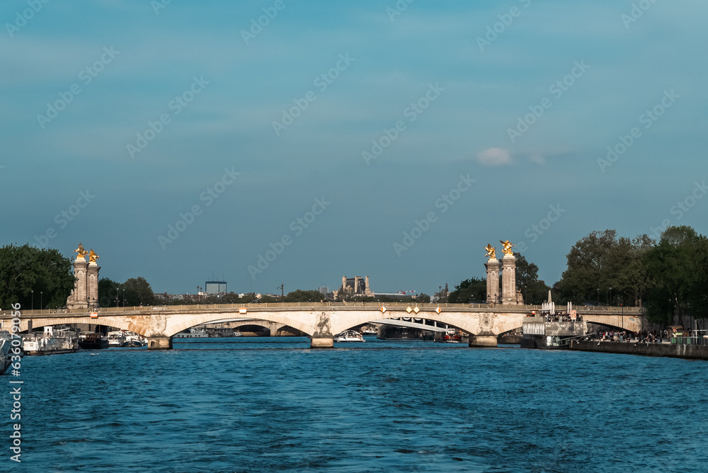 Paris, France. April 22, 2022: Famous Alexander III Bridge with beautiful blue sky.