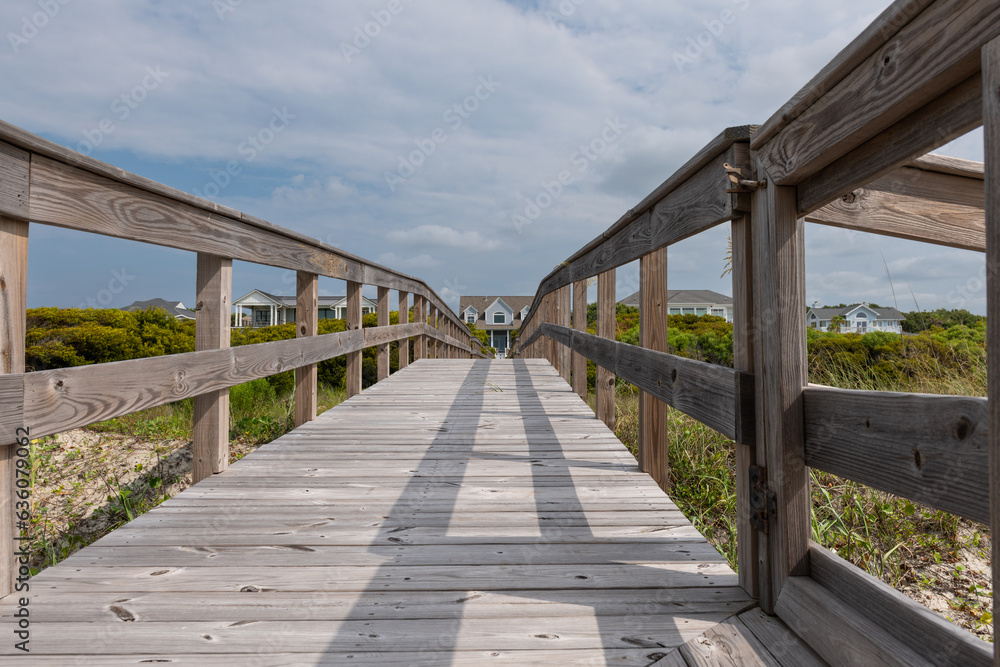 Wooden boardwalk from the beach to vacation home.