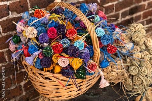 Painted roses made of sweet grass, also called palmetto roses, were first created during the Civil War by women to give to their husbands or sons who were going off to fight for the Confederacy. photo