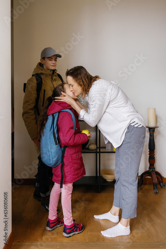 Morning time. Daily routine. Family. Corridor. Kiss. Happiness photo