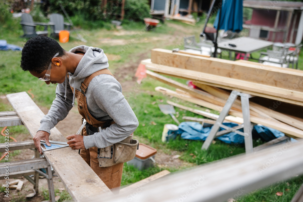 Skilled Carpenter at Work: Using Wood and Tools for Her Occupati Skilled Carpenter at Work: Using Wood and Tools for Her Occupati