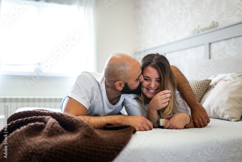 couple in love on the bed in their room