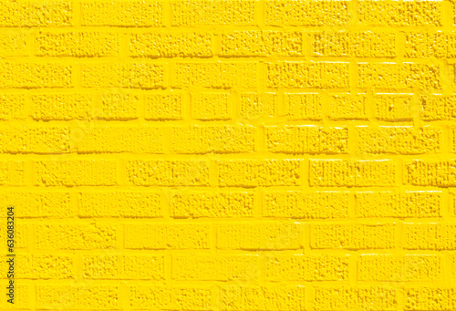 Brick wall painted yellow photo