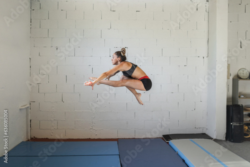 artistic gymnastics athlete training in a gym