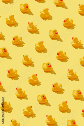 Stylish pattern with yellow rubber ducks. photo