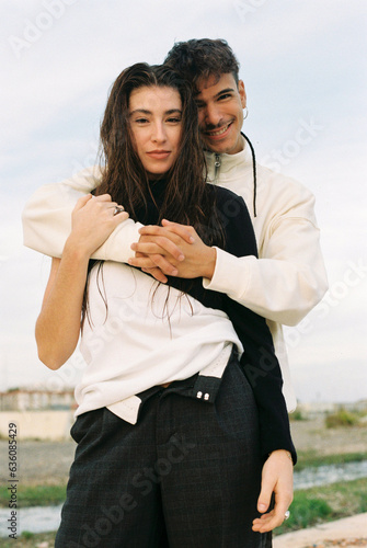 Young and modern couple at sunset