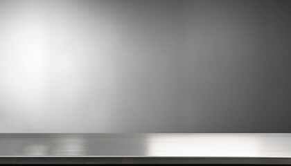 Silver steel countertop, empty shelf. Kitchen counter on gray background with spot light. Bar desk surface in foreground