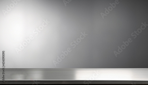 Silver steel countertop, empty shelf. Kitchen counter on gray background with spot light. Bar desk surface in foreground photo