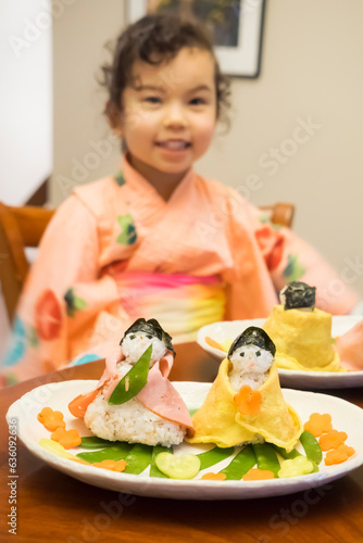 Girl and homemade Sushi dolls for Japanese Doll's Festival  photo