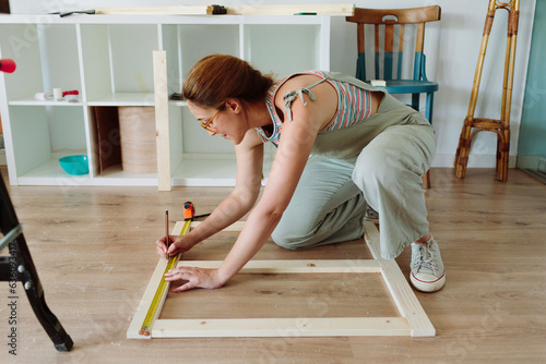 Woman working on a DIY project photo