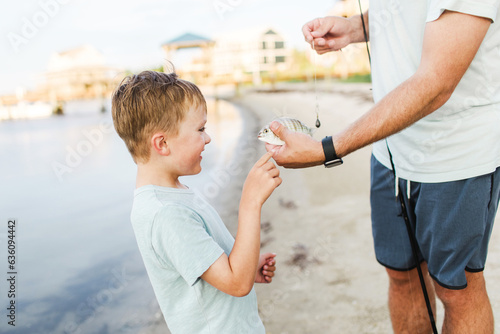father and son fishing together photo
