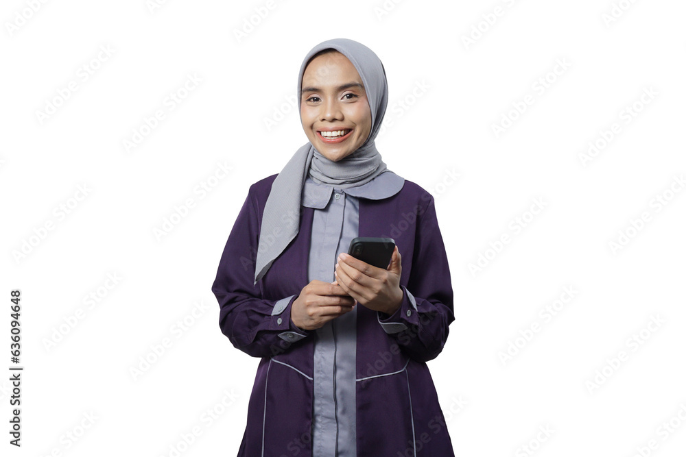 Cheerful beautiful Asian woman in casual shirt and hijab using a mobile phone Cheerful beautiful Asian woman in casual shirt and hijab using a mobile phone