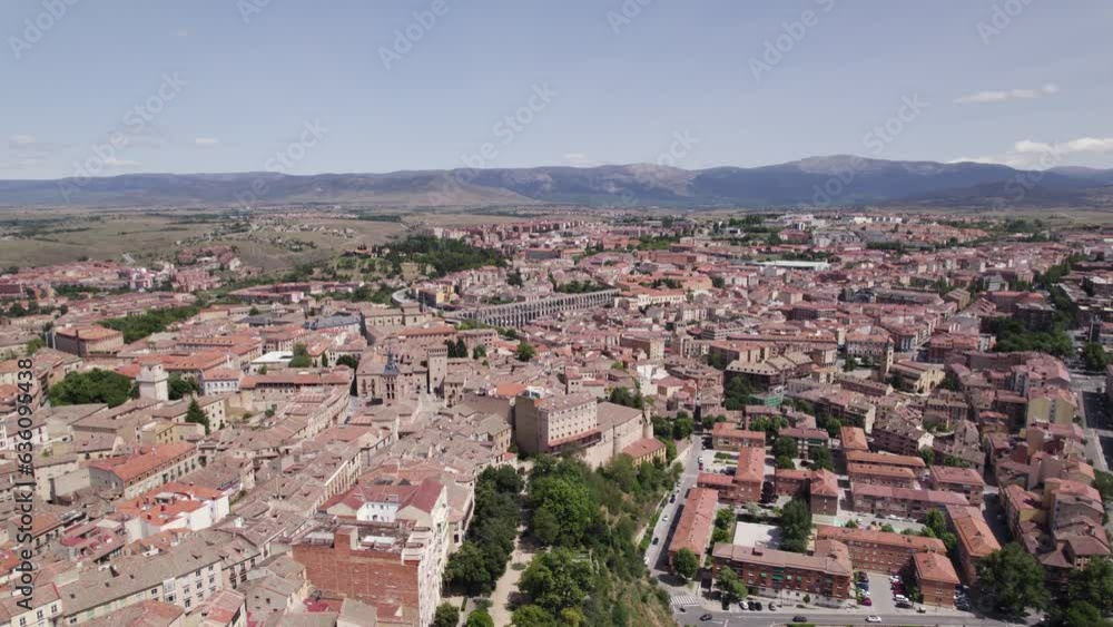 Tranquil drone view across medieval city center to mountains. Segovia Tranquil drone view across medieval city center to mountains. Segovia