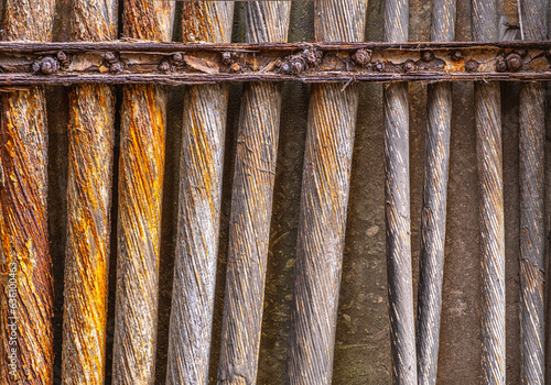 row of rusty metal cables