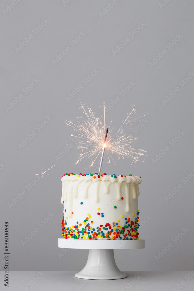 Birthday cake with white drip icing and colorful sugar sprinkles Stock ...