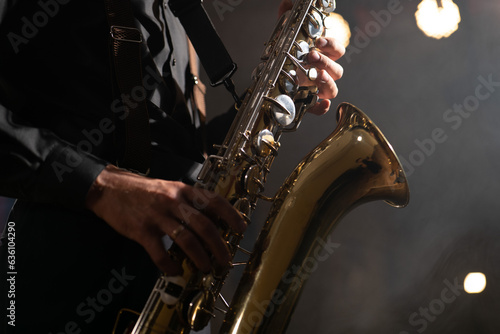 Canvas Print Saxophone man. Saxophonist hands and saxophone.