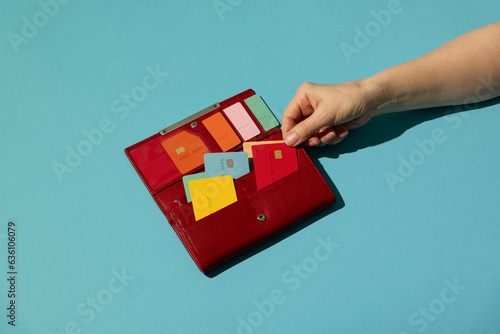 Colorful credit/debit cards in red purse. Money, cashless, payment photo