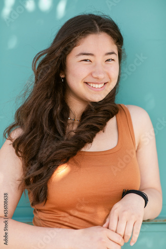 Mixed-race teen girl laughing portrait
