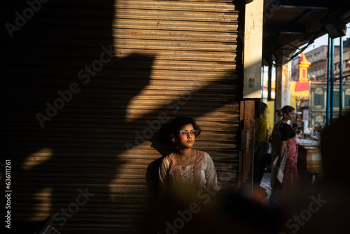 Portrait of a teenage girl in front of a closed shop in a urban area photo