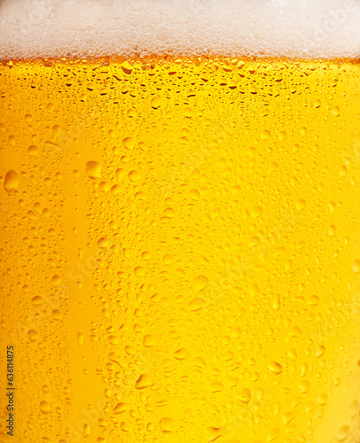 Closeup of a beer in a glass with bubbles. photo