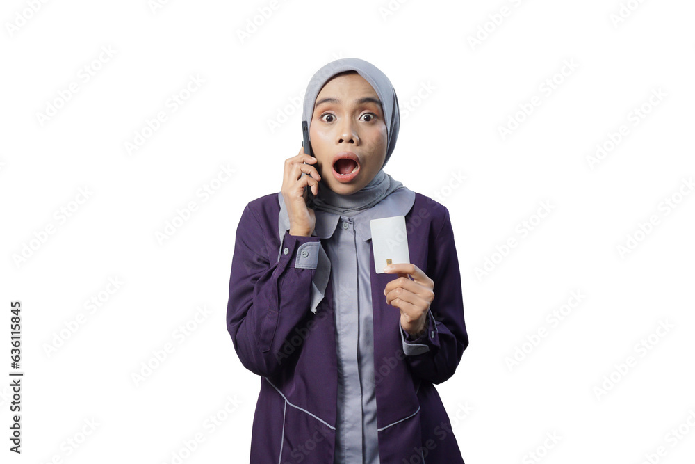 Cheerful beautiful Asian woman in casual shirt and hijab showing credit card Cheerful beautiful Asian woman in casual shirt and hijab showing credit card