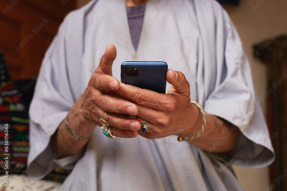 Mature Moroccan man on the streets of Marrakech Using Mobile Phone Mature Moroccan man on the streets of Marrakech Using Mobile Phone