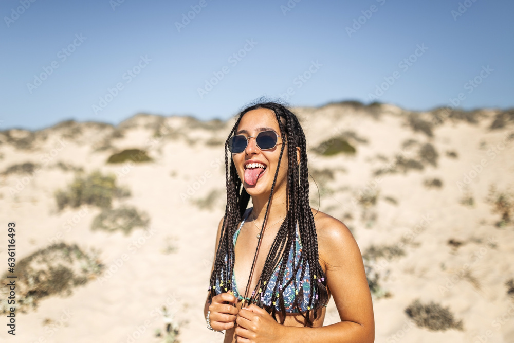portrait of teenager with braids in the beach portrait of teenager with braids in the beach