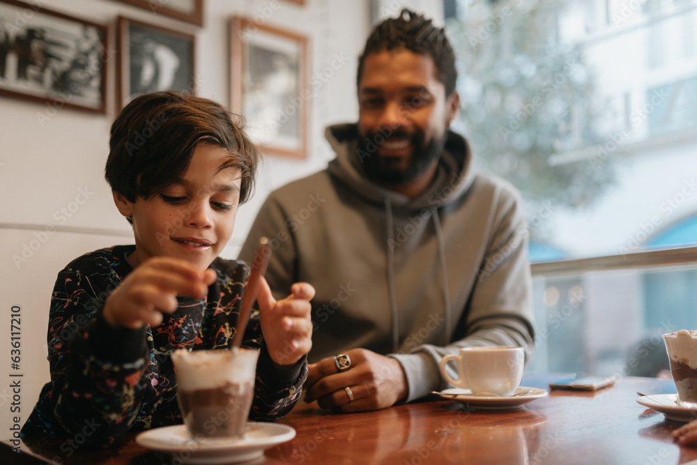 Family having chocolate in a cafe Family having chocolate in a cafe