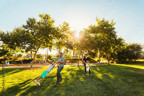 Young family in park.