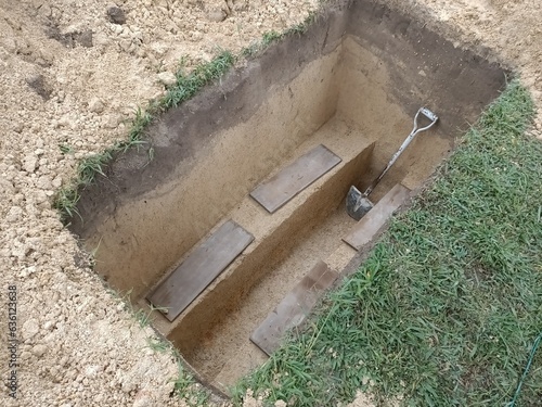 Obraz na plátně Muslim cemetary newly dug  empty grave hole