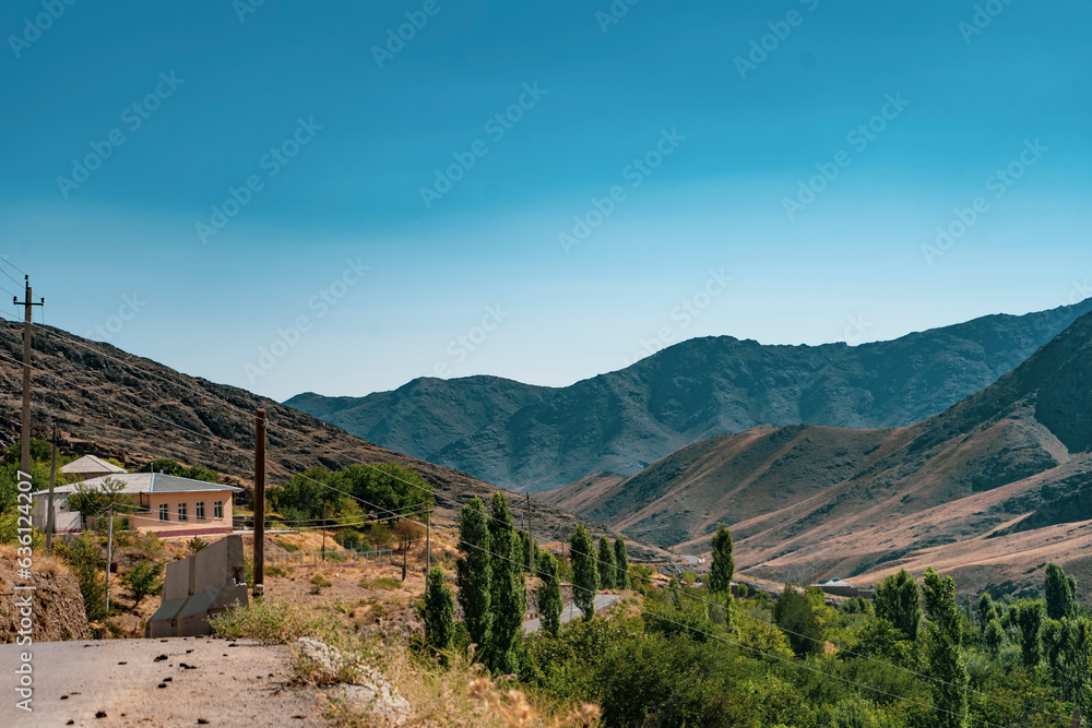 Naklejka premium mountains view from a roadside hill