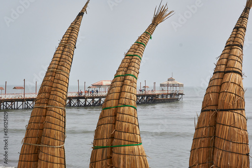 Totora reed horses adorn the beaches of Huanchaco photo