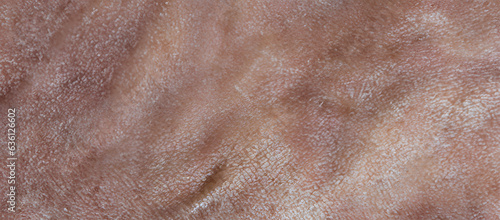 Close up of brown old skin texture, wrinkled of human skin