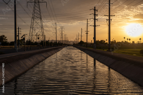 Chandler Arizona Canal at sunset powerlines and telephone poles in background photo