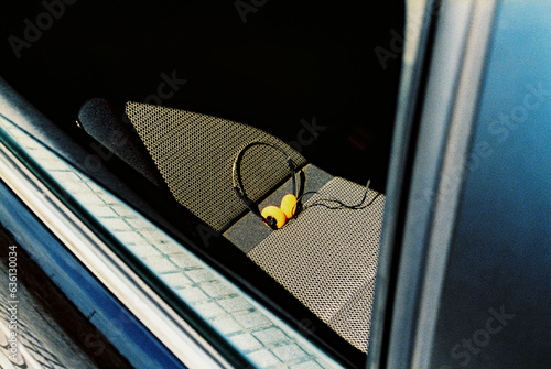 headphones on the back seat of a car, 35mm film photo