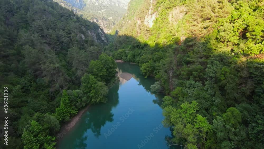 FPV drone flight over beautiful tranquil river surrounded by trees and mountains - Children and people resting on sandy beach at stream in Lebanon FPV drone flight over beautiful tranquil river surrounded by trees and mountains - Children and people resting on sandy beach at stream in Lebanon