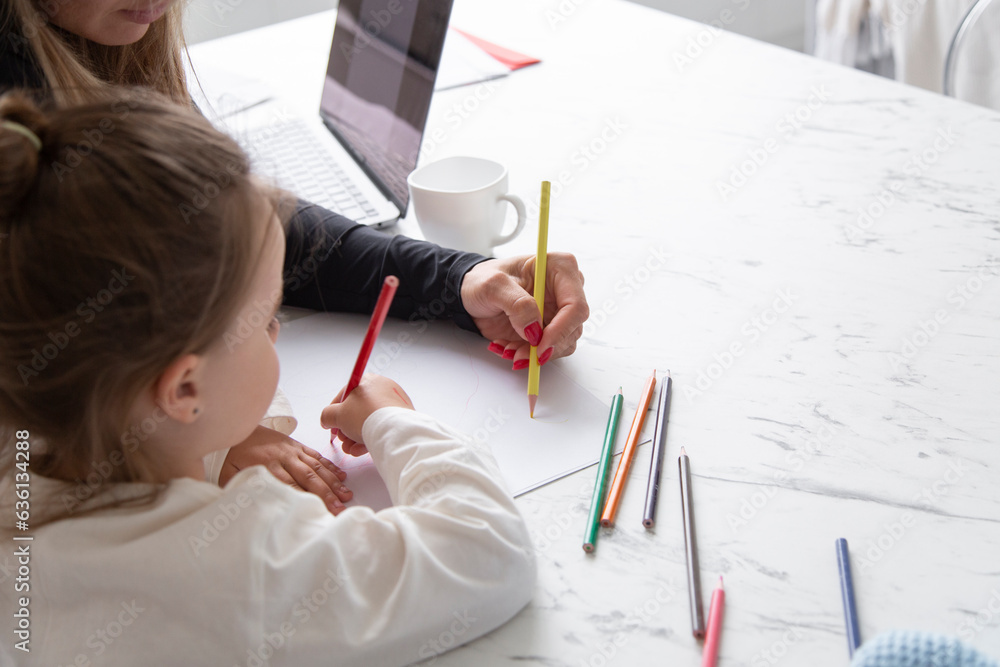 Mother and daughter drawing with pencils at home Mother and daughter drawing with pencils at home