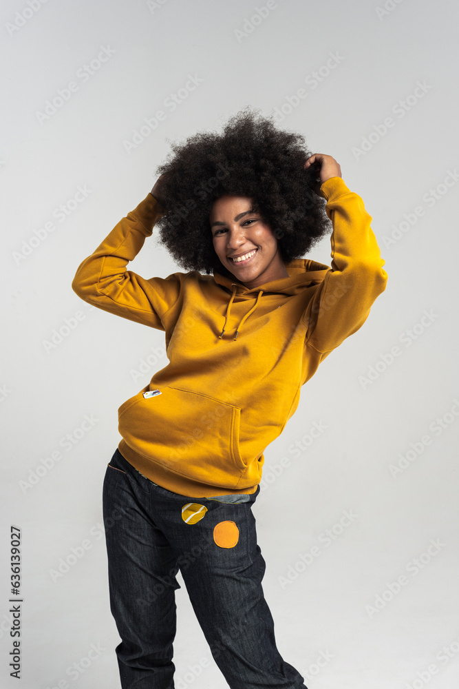 Studio shot of positive emotional woman with afro Studio shot of positive emotional woman with afro