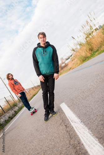 Surreal tilted portrait of falling man on the road