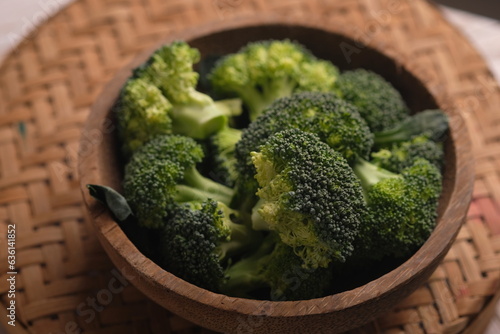 Broccoli is a cultivar of the same species as cabbage and cauliflower, namely Brassica oleracea. Brassica oleracea var. italica. Broccoli florets in a wooden bowl.