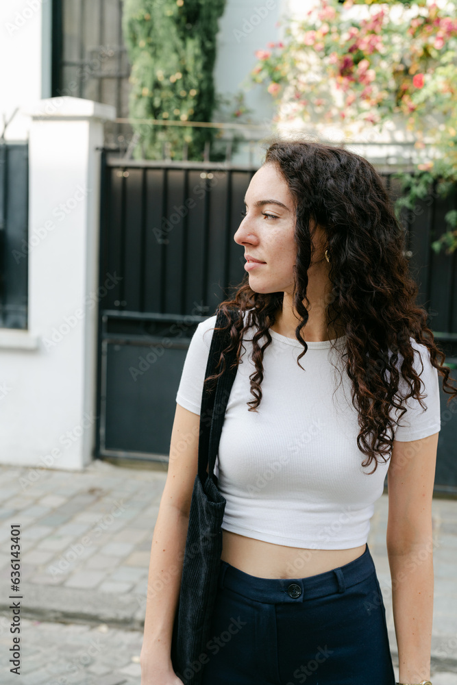 portrait on young confident woman with curly hair. portrait on young confident woman with curly hair.
