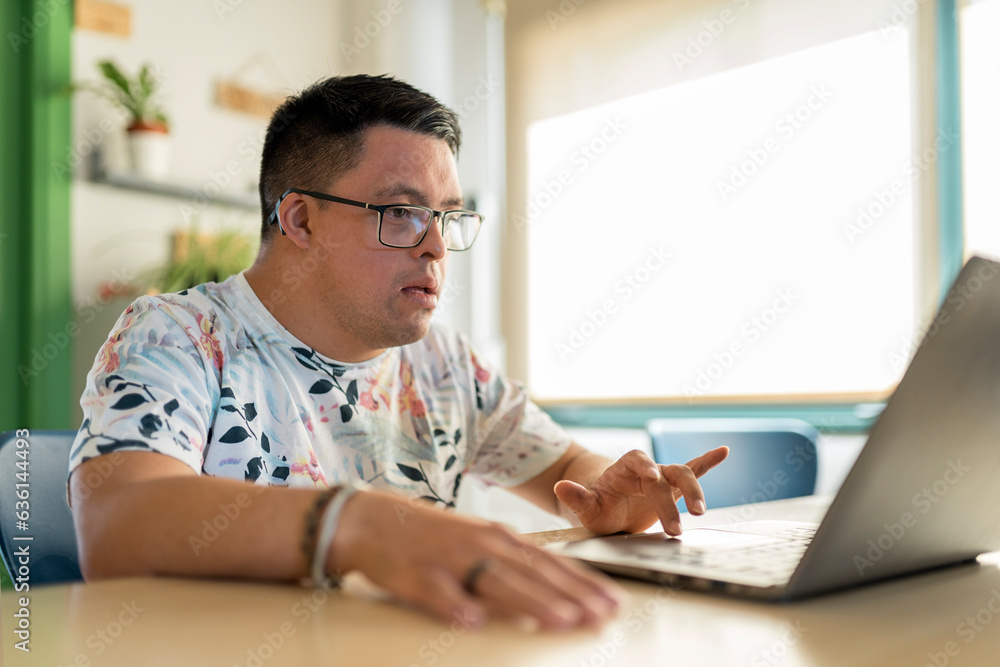 Focused man using computer in Special Education School Focused man using computer in Special Education School