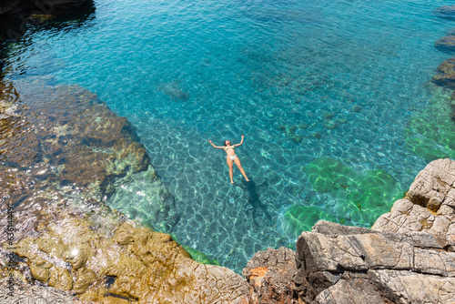 Woman enjoying floating on water