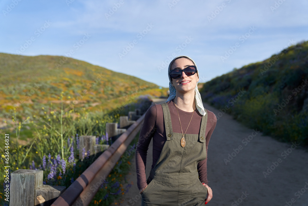 Pretty muslim girl in nature with sunglasses and overalls Pretty muslim girl in nature with sunglasses and overalls