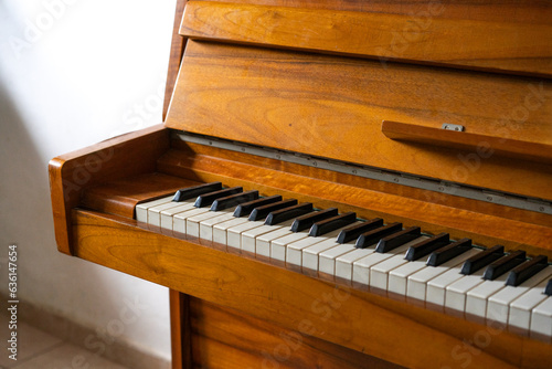 Piano Serenity. Open Keyboard, White Wall, Daylight. photo