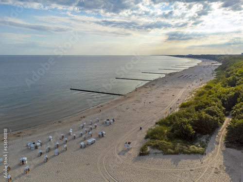 Obraz na płótnie Aerial view landscape, view of beach, sea and pier in Kolobrzeg, Poland. Baltic sea. Forest , clouds. w salonie