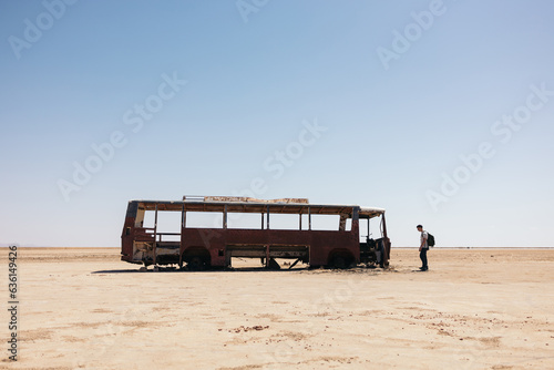 abandoned bus in the Sahara desert photo
