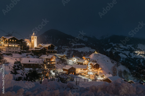 Small mountain town covered in snow photo