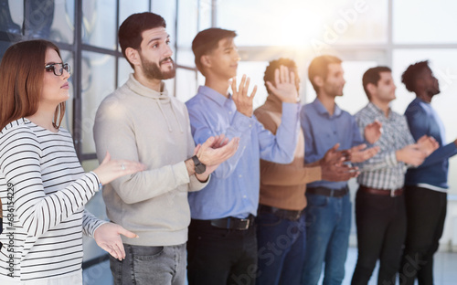 Close up side profile, different participants business people stand and express appreciation by clapping their hands