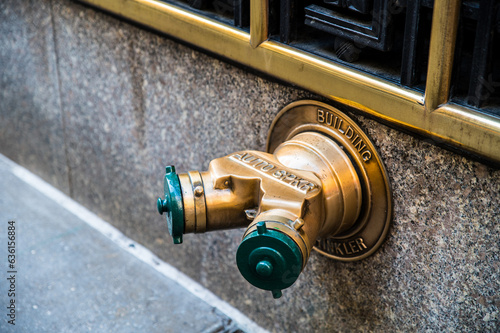 Fire hydrant on wall in city